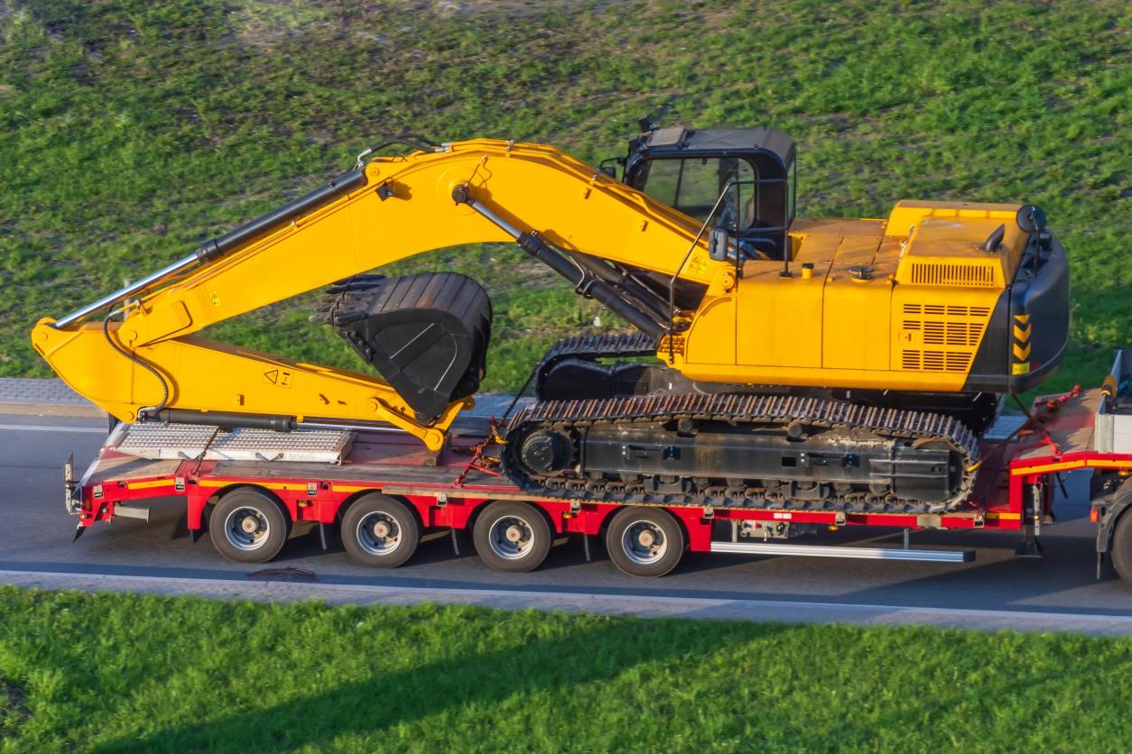 Convoyance.com Services Large Excavator on Trailer